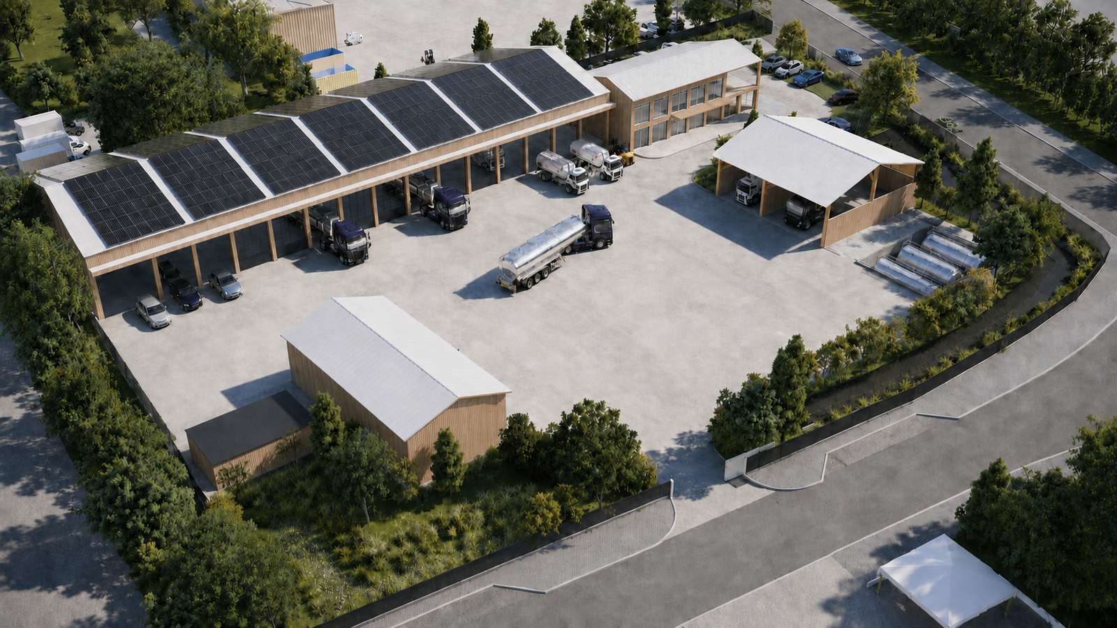 La cour du complexe industriel de Valognes, auvents bois et camions-citernes, vue aérienne