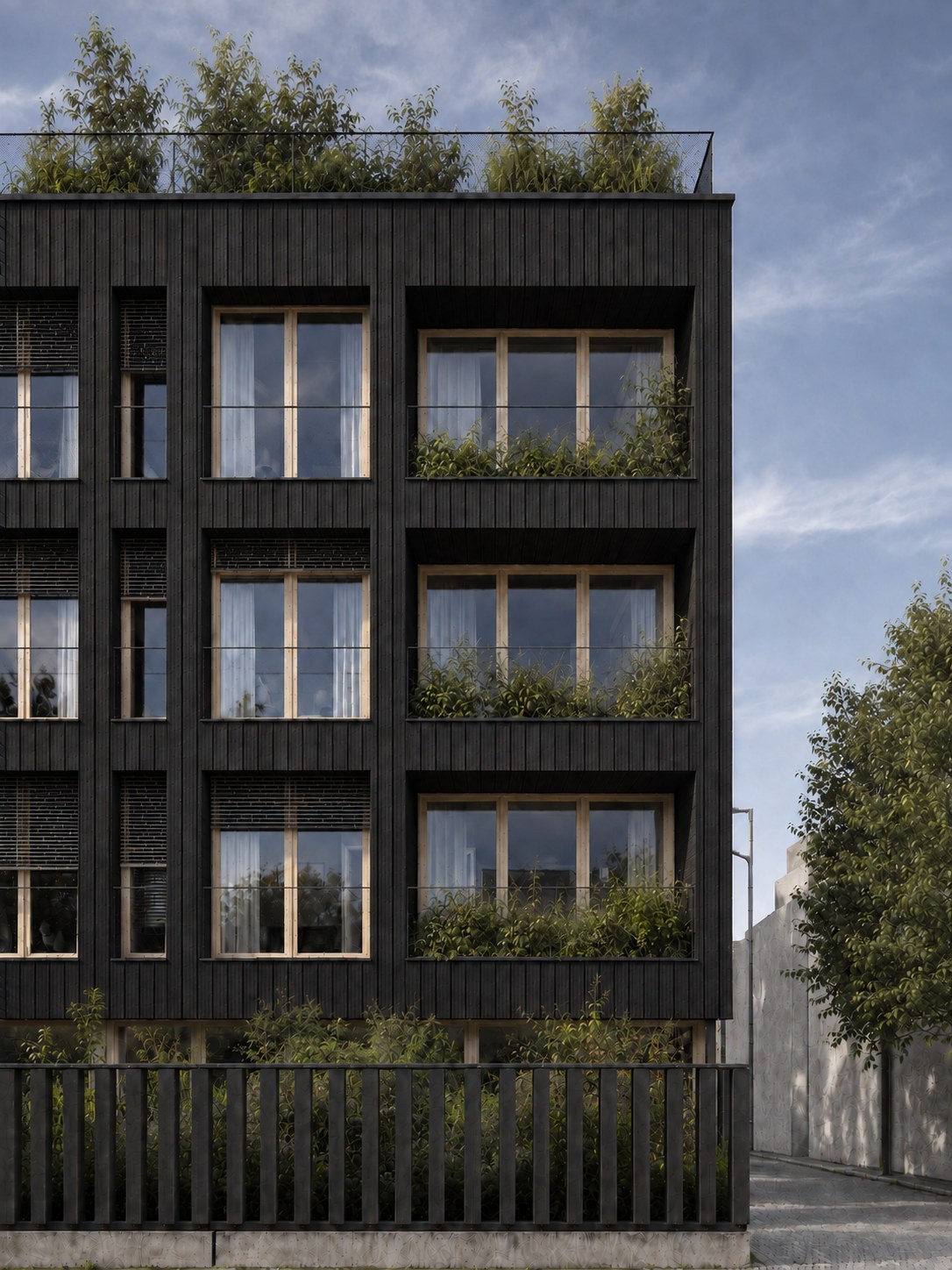 Façade sur rue de Bois de ville à Bezons, bardage en bois brûlé et toiture plantée